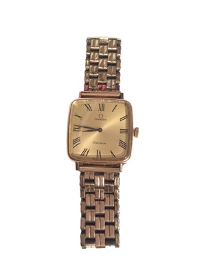 Lot 243 - 1970s Gentleman's Omega wristwatch in gold plated square case, manual wind movement on plated bracelet