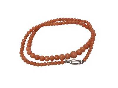Lot 466 - Antique pink coral bead necklace with a string of graduated coral beads