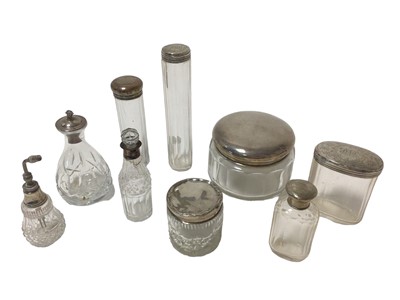 Lot 388 - Collection of 19th and 20th century silver topped toiletry bottles