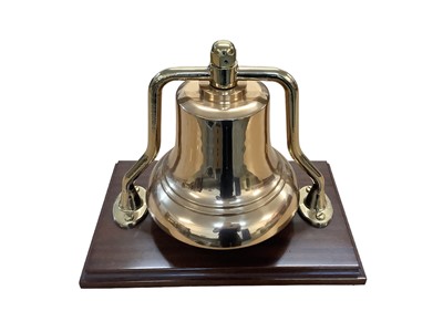 Lot 811 - Large 20th century brass fire engine bell, mounted on wooden plinth, approx 31cm in height.