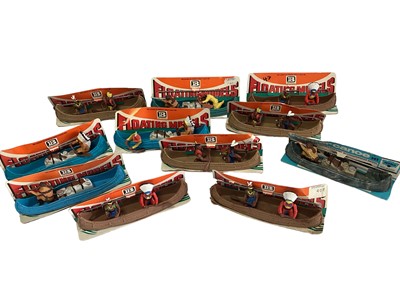 Lot 1846 - Britains floating models Canoes (some with figures missing), on card stand (11)
