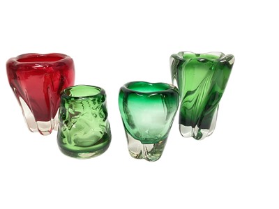Lot 1121 - Three Whitefriars Meadow green vases including a knobby vase, 12.5cm high, together with a Ruby Molar vase, 18cm high (4)