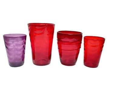 Lot 1122 - Three various Whitefriars Ruby vases, largest is 21cm high, together with an Amethyst vase (4)