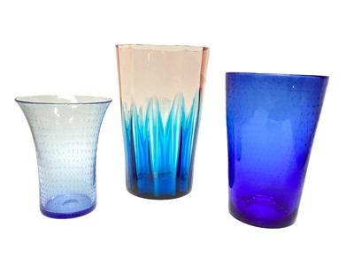 Lot 1124 - Good quality blue and pink tinted glass vase, 30cm high, together with two blue Whitefriars vases, 25.5cm and 20cm high (3)