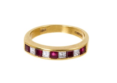 Lot 559 - Ruby and diamond eternity ring in 18ct gold setting