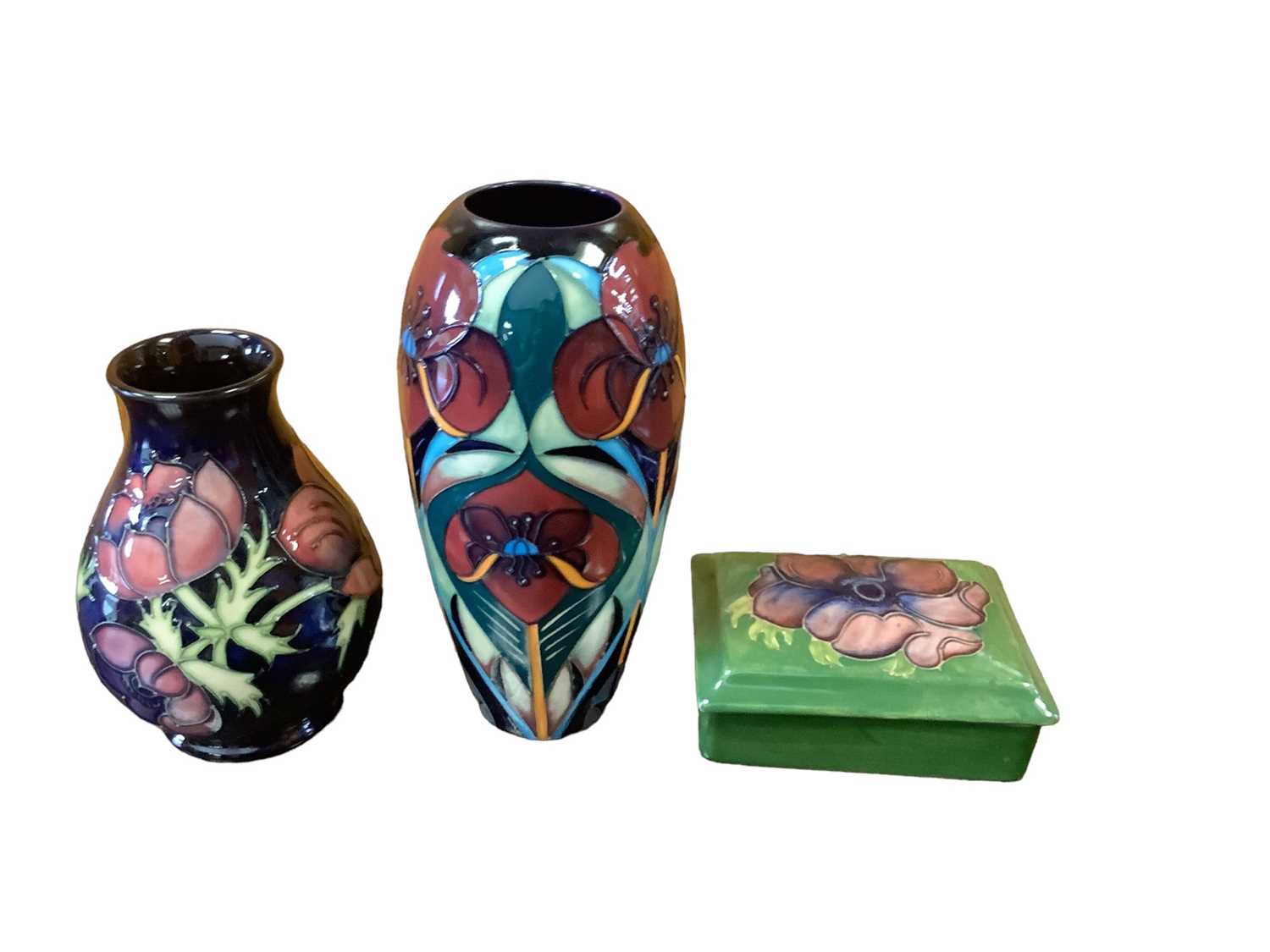Lot 1147 - Moorcroft vase by Rachel Bishop, Moorcroft Anemone pattern vase and a Moorcroft trinket box and cover (3)