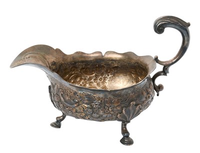 Lot 333 - Mid 18th century embossed silver sauce boat