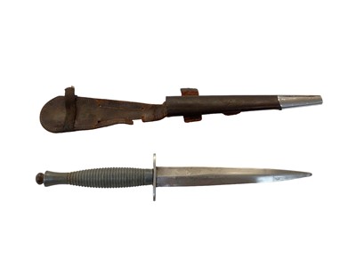 Lot 948 - Post Second World War Third Pattern Fairbairn Sykes F-S fighting knife with ribbed alloy hilt and unusual etched blade, in original leather sheath.
