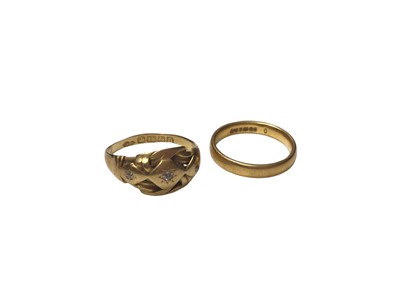 Lot 114 - 18ct gold three stone diamond knot ring and a 22ct gold wedding ring (2)