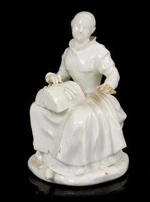 Lot 60 - White glazed porcelain figure of a lacemaker