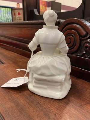Lot 60 - White glazed porcelain figure of a lacemaker