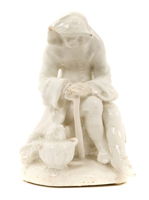 Lot 23 - Bow white glazed porcelain figure of a man before a brazier emblematic of winter, probably Longton Hall
