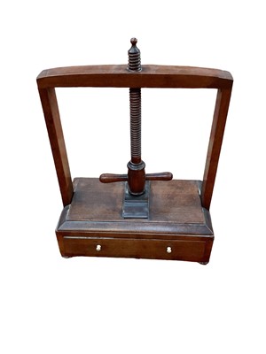Lot 1501 - Regency mahogany table top book press with drawer on bun feet