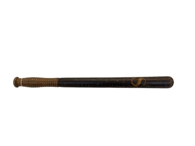 Lot 945 - 19th century black painted turned wood Police truncheon with gilt lettering 'C S', with ribbed grip, marked H&L Born, 37.5cm in length.