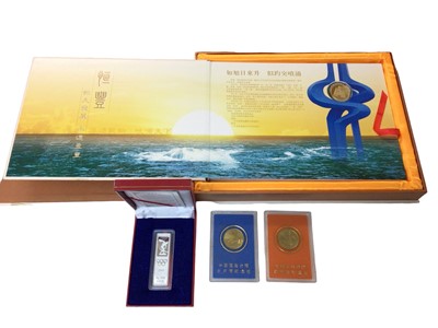 Lot 483 - China - Mixed H F Bank issued banknotes in presentation folder, .999 silver 100gms Olympics Bullion Bar