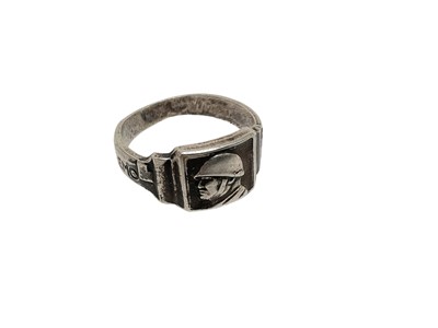 Lot 739 - Second World War Italian fascist white metal ring with a bust of Mussolini wearing a steel helmet flanked by the motto "Noi Tireremo Diritto"