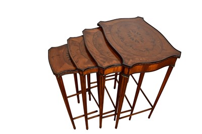 Lot 1354 - Nest of four George III style satinwood and marquetry inlaid tables, of serpentine form