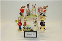 Lot 2102 - Fourteen Royal Doulton Bunnykins figures -...