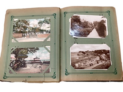 Lot 1441 - Postcards in two albums including shipping, greetings, artist drawn, topographical, comic etc.