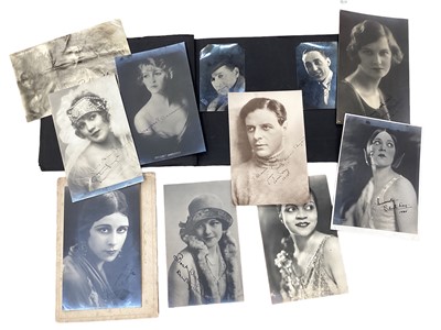 Lot 1442 - Postcards and Photographs in three albums, film and stage stars including Fay Compton, Alice Terry, Gary Cooper, Gracie Fields and others, some signed.