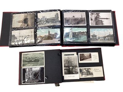 Lot 1447 - Postcards in two albums including London, shipping, views, French cards etc.
