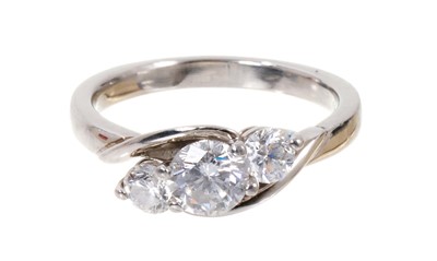 Lot 550 - Diamond three stone ring with three brilliant cut diamonds estimated to weigh approximately 1.25cts, in cross-over platinum setting
