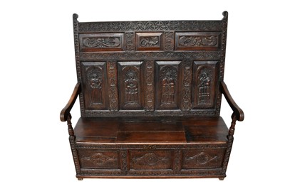 Lot 1384 - Elaborate carved oak settle