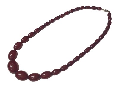 Lot 5 - Simulated cherry amber graduated oval bead necklace