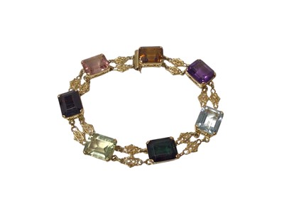 Lot 566 - Gold and multi-gem bracelet