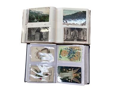 Lot 1466 - Postcards in five albums including hold to light Christmas, aviation, shipping, children's, greetings, birthday, animals, railway, miltary, real photgraphic and topographical.