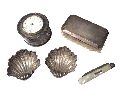 Lot 51 - Pair of Edwardian silver shell salts, silver cased desk clock, silver backed brush and a silver and mother of pearl fruit knife