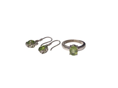 Lot 55 - 18ct white gold peridot ring and a similar pair of earrings