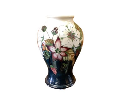 Lot 1136 - Moorcroft pottery Trial vase decorated with flowers, dated 16/3/10, 16cm high