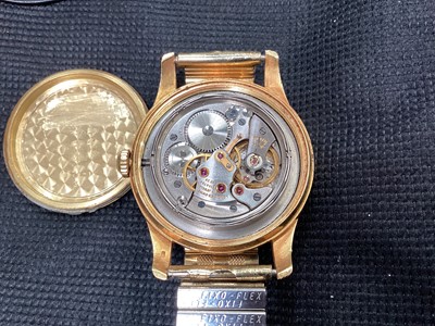 Lot 71 - 1970s Gentleman's Longines 18ct gold wristwatch with circular dial, applied gilt arrow markers in gold plated case, 34mm diameter