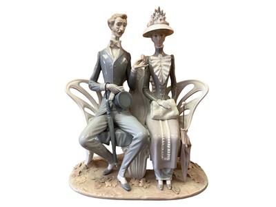 Lot 1151 - Lladro porcelain figure group - lovers on a bench, 30cm high