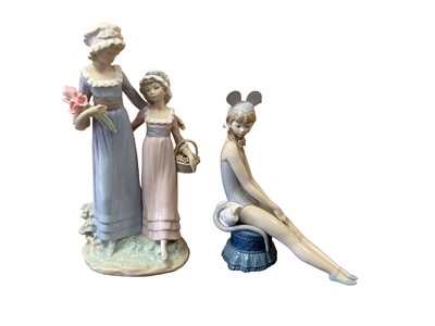 Lot 1152 - Lladro porcelain figure group - females with flowers, 32.5cm high, together with another Lladro figure, 25cm high (2)