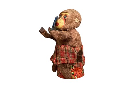 Lot 1921 - Automaton Piggy Chef tin plate and plastic plus tin plate and fabric automaton clockwork monkey with mirror.