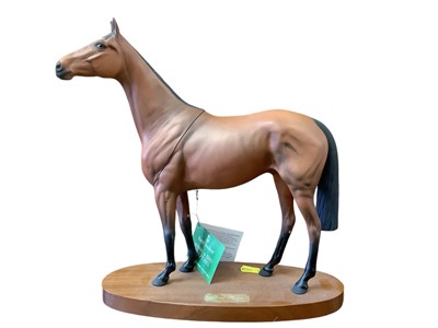 Lot 1185 - Royal Doulton model of Red Rum on plinth base, 32cm high