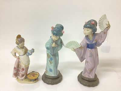 Lot 1195 - Two Lladro porcelain figures of geisha girls, tallest is 30.5cm high, together with another Lladro figure of a Spanish girl cooking paella (3)