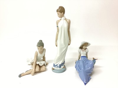 Lot 1197 - Six Nao porcelain figures including lady in white dress, 31cm high, ballerina, girl holding a pink flower etc