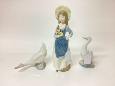Lot 1198 - Two Nao porcelain geese, Lladro style figure of a girl holding flowers, selection of Murano glass sweets, glass pedestal dish and other ornaments