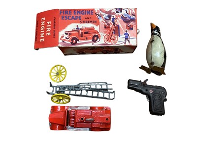 Lot 1964 - Merit vintage Driving Test game, tin plate clockwork penguin, Charbens Series Fire Engine & pistol (qty)