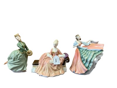 Lot 1234 - Six Royal Doulton figures - Reverie HN2306, The Bedtime Story HN2059, Lynne HN2329, Ann HN3259, Grace HN2318 and Sandra HN227, together with a Doulton vase and three character jugs (10)