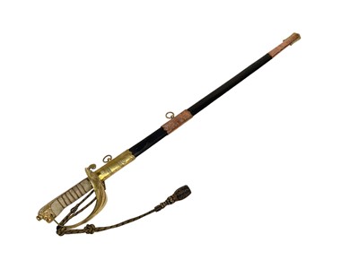 Lot 920 - George V British Naval Officers dress sword by Friedeberg, Portsea with regulation brass gothic hilt with dress knot, etched blade retaining all original polish decorated with Royal Arms and crowne...