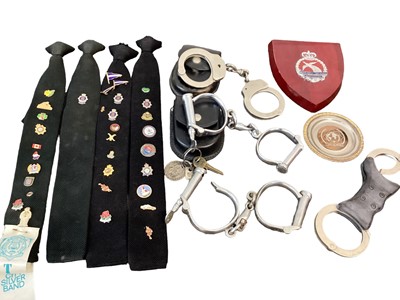 Lot 872 - Collection of Police related items including handcuffs by Hiatt, other handcuffs, Essex Police helmet plate and other Police related items (1 box).