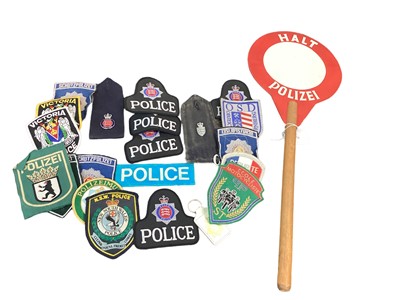 Lot 874 - Collection of Police related cloth badges and various other items including a German Police traffic control baton.