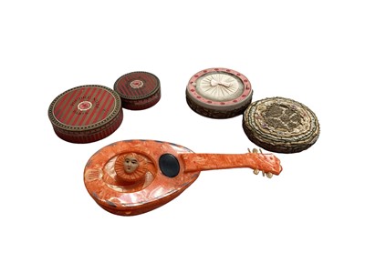 Lot 2129 - 1920s Orange bakelite Pierrot mechanical powder puff plus three Nilde Paris & London boxed power and puffs, two used , one some use.  One box has been decorated with narrow ribbons.