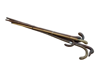 Lot 2554 - Old novelty carved wood ducks head handle walking stick, two Officers pigskin covered sticks and others (6)