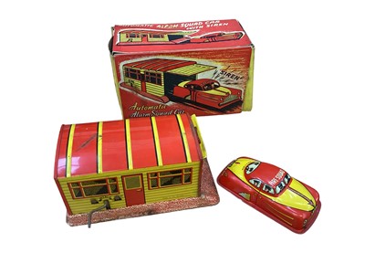 Lot 2016 - Tinplate selection including Automatic Alarm Squad Car with siren, in original box, Police Chief & Fire Chief Cars, Triang Lorry & Sailboat (qty)