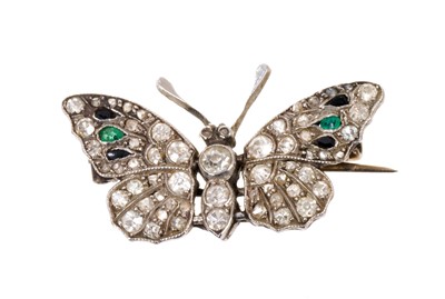 Lot 486 - Edwardian diamond emerald and black onyx butterfly brooch